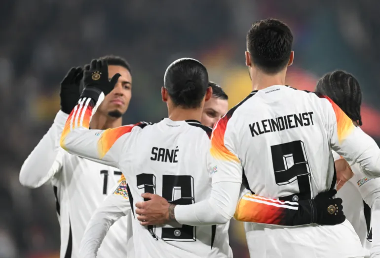 Leroy Sane celebrates with teammates