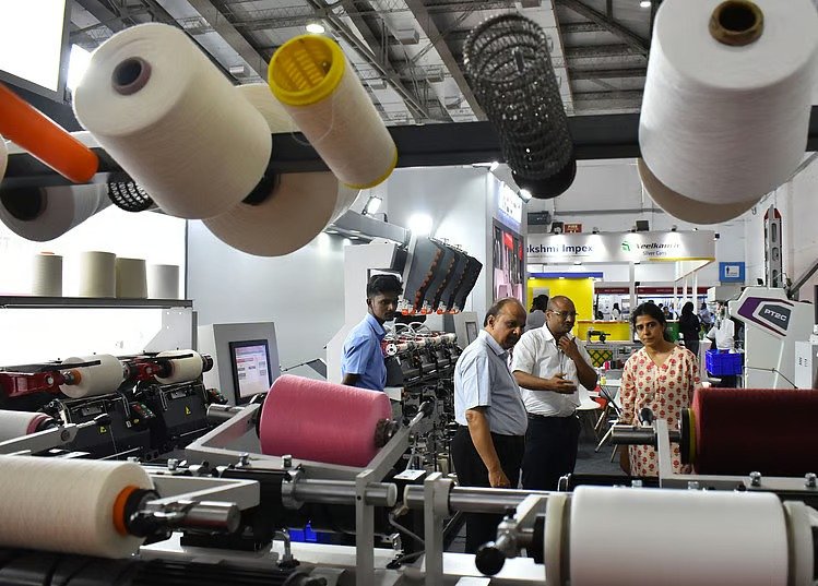 Visitors exploring advanced machinery at the Coimbatore textile accessories spares expo during SIMA Texfair 2026 at CODISSIA Trade Fair Complex