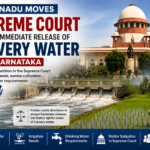 Flowing Cauvery River with agricultural fields in Tamil Nadu, representing the state's petition in the Supreme Court for water release.