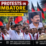 DMK members staging a peaceful protest in Coimbatore, holding party flags and banners over the arrest of Udhayanidhi Stalin.